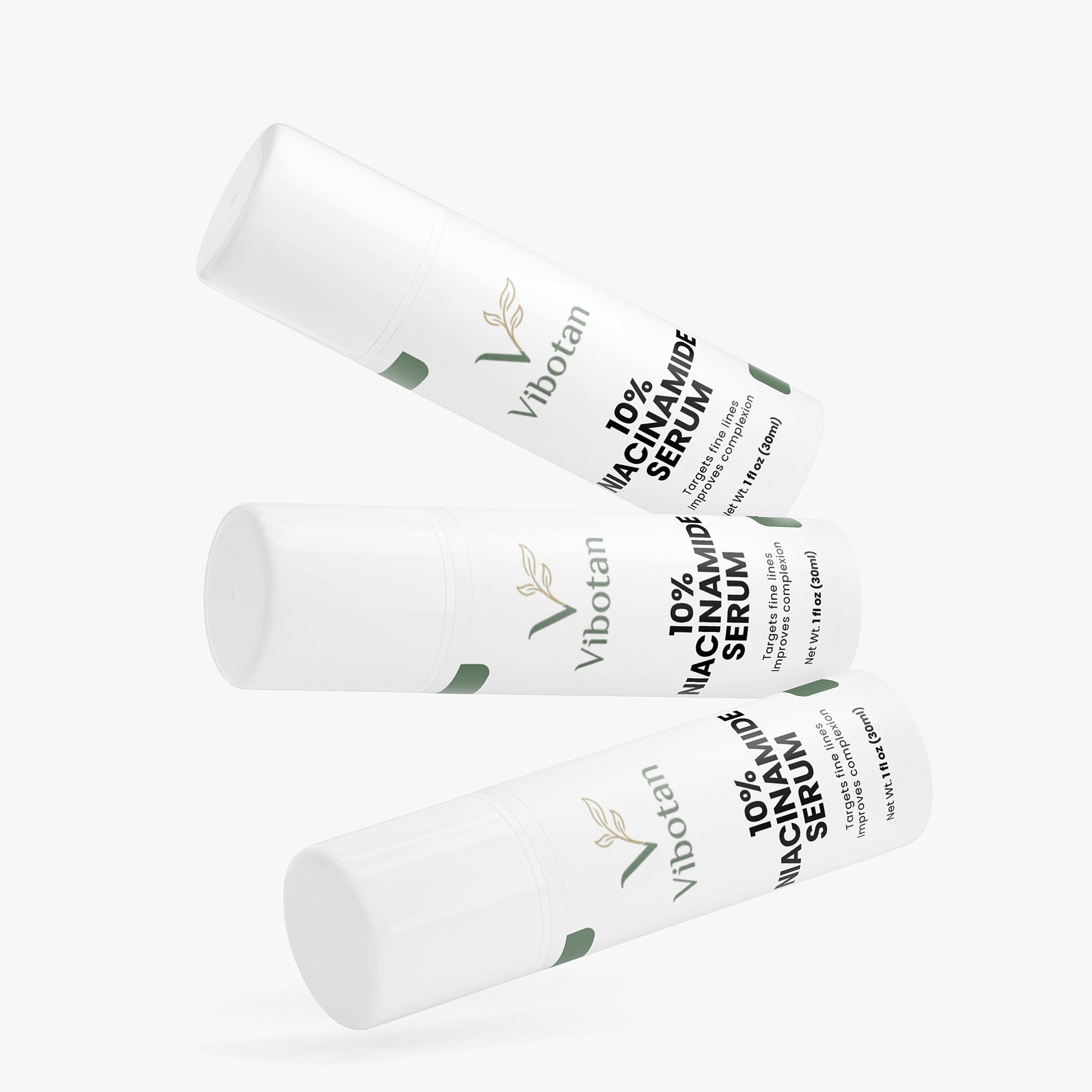 Three bottles of Vibotan 10% Niacinamide Serum on a white background