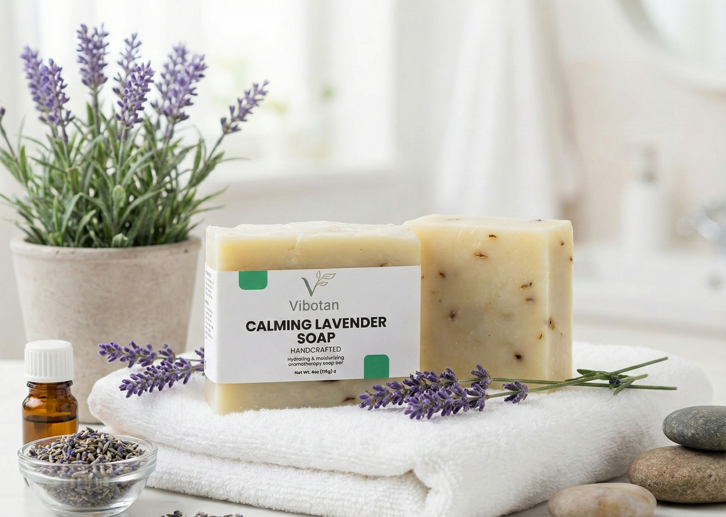Calming lavender soap on a towel with lavender flowers and essential oil bottle in the background