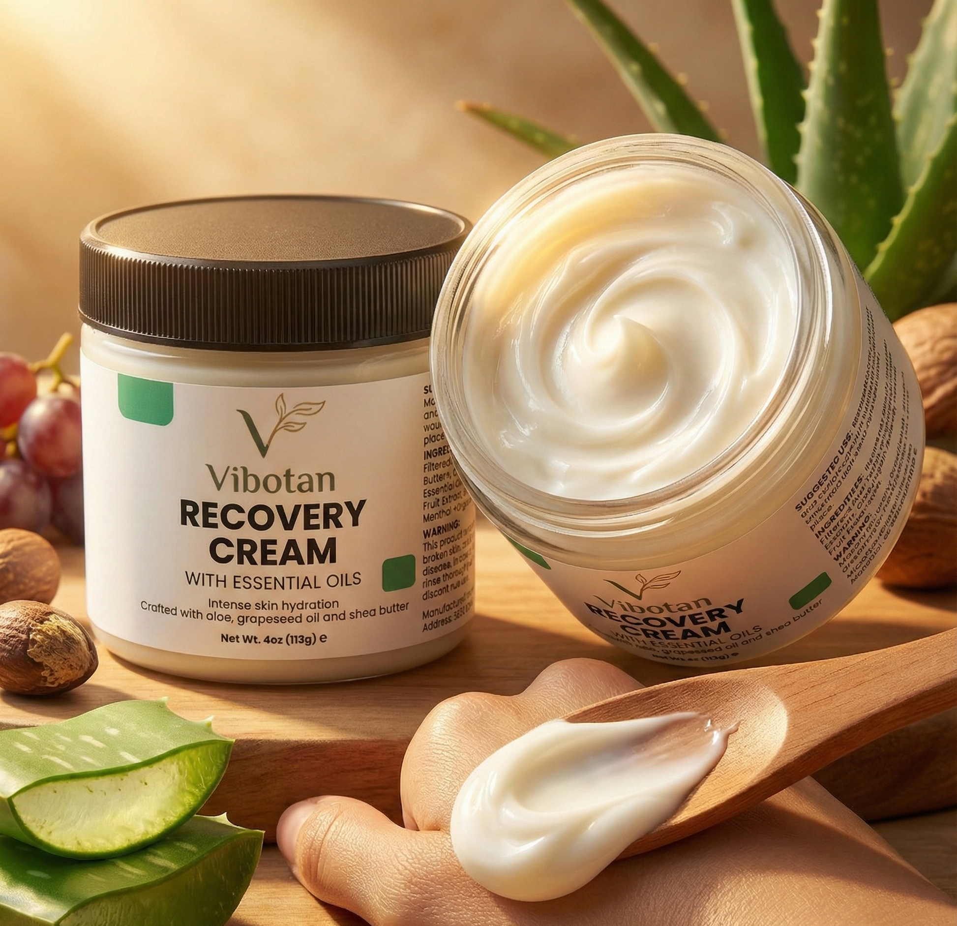 Vibotan Recovery Cream jar with open lid, cream on a wooden spoon, and aloe vera leaves in the background.